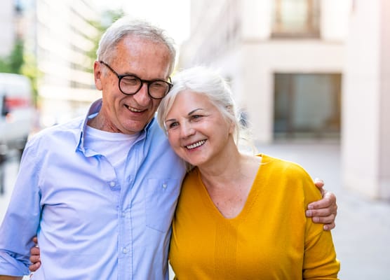 Senior couple smiling together outdoors