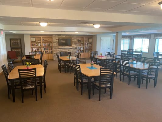 Spacious dining room with tables and chairs