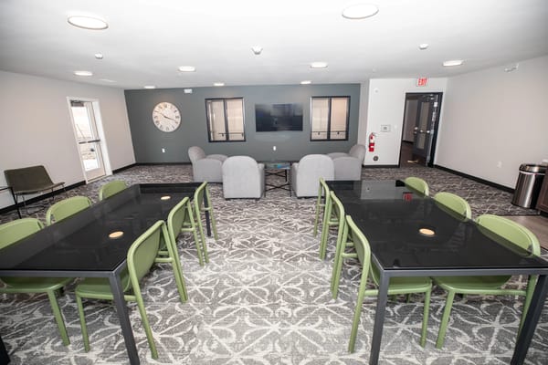 Bright, inviting common area with seating and décor