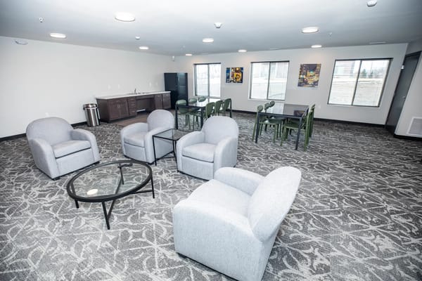 Bright common area with seating and tables