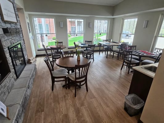 Lounge area with tables and seating near windows