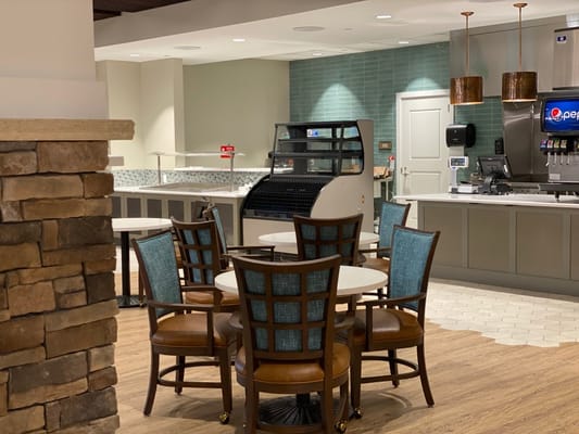 Interior dining area with seating and food counter