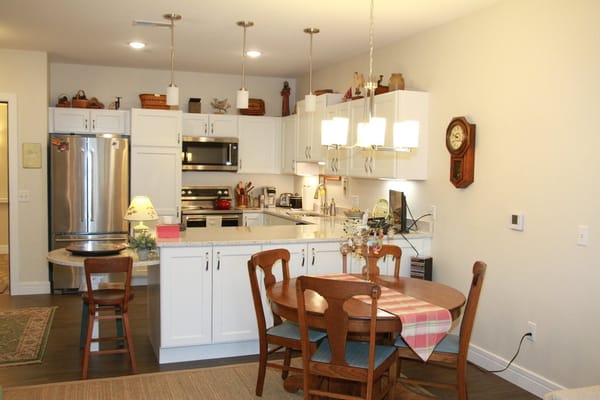 Interior kitchen space with dining table and chairs