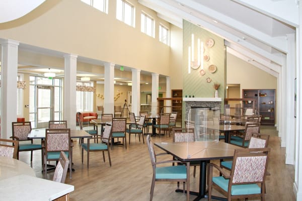 Bright common area with tables and chairs