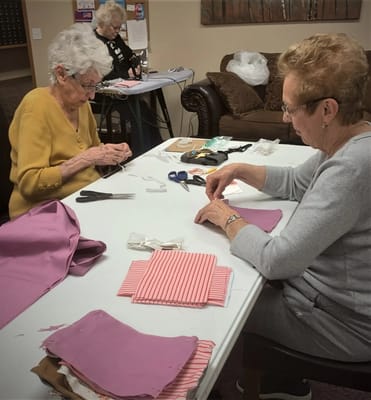 Two residents engaged in a crafting activity