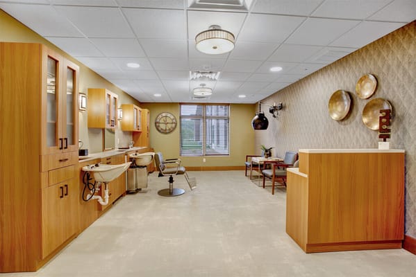 Salon space with seating and styling stations in Prairie Gate.