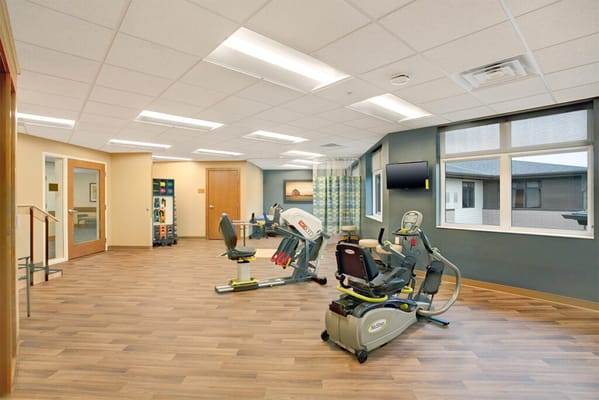 Well-equipped therapy room with exercise machines