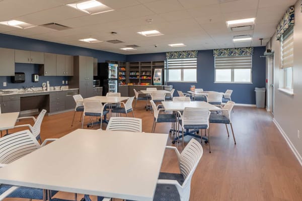 Bright dining room with tables and chairs