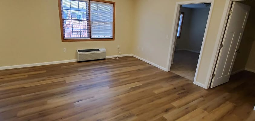 Empty interior room with wooden flooring