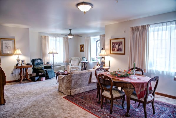 Bright common area with cozy seating and decor