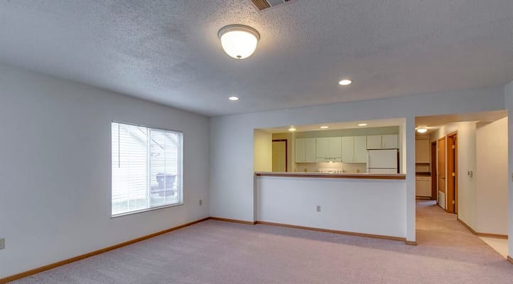 Bright living room with window and open kitchen area