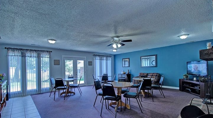 Bright and spacious common area with seating and windows