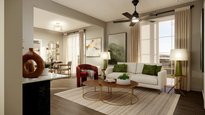 Cozy living room featuring a sofa, armchair, and decorative plant.