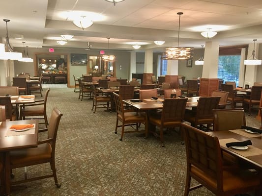 Interior view of the dining room with tables and chairs
