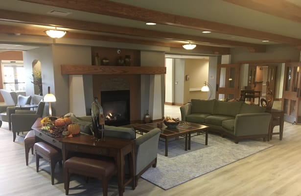 Cozy common area with seating and a fireplace