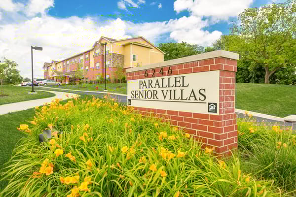 Exterior view of Parallel Senior Villas sign and building