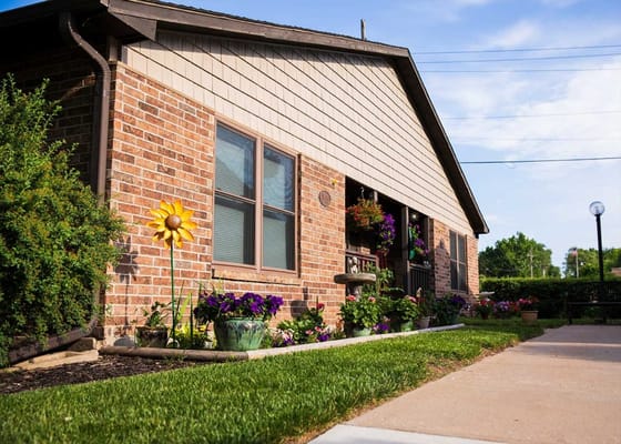 Exterior view of Shorey Villa with colorful flowers
