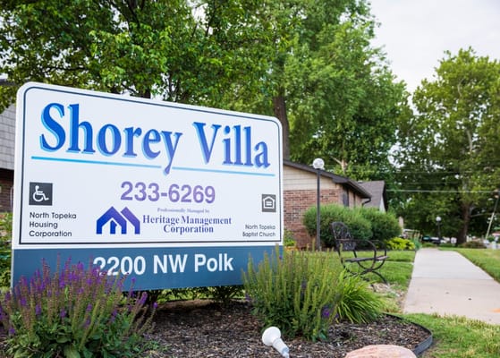 Sign for Shorey Villa with landscaped exterior