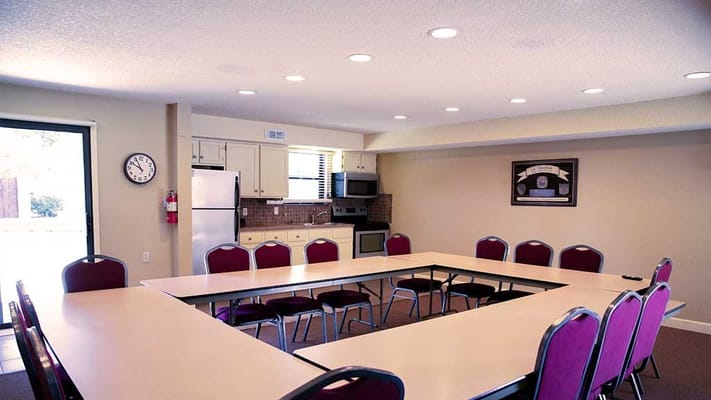 Bright community room set up for a meeting