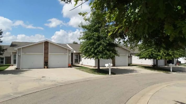 A quiet street view of Wesparke Village Apartments