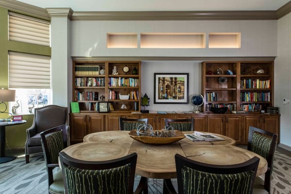 Interior common area with bookshelves and a round table