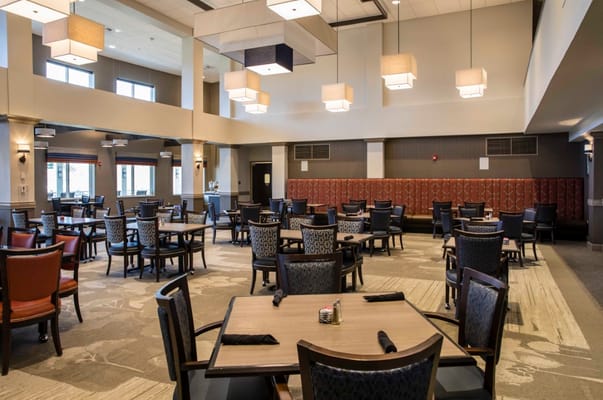 Dining area with tables and chairs in a modern design