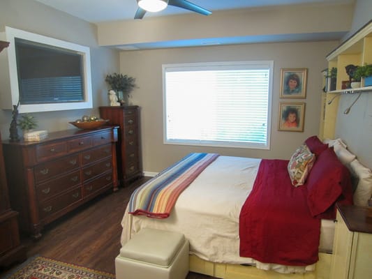 A cozy resident bedroom with warm colors and decor