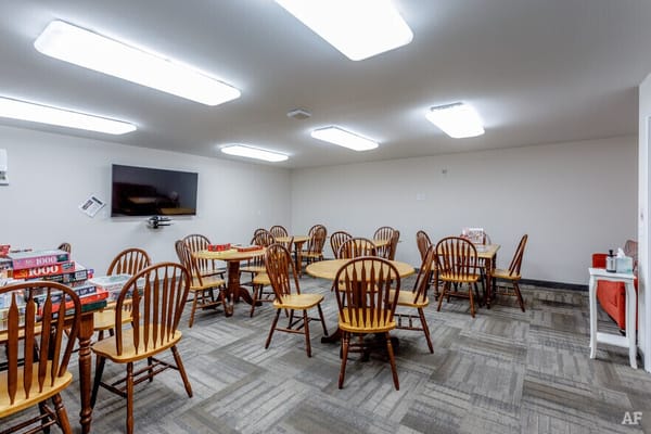 Bright common area with tables and chairs