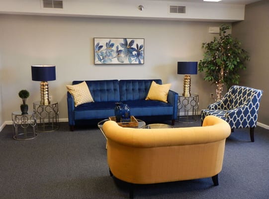 Bright common area with stylish furniture and decor