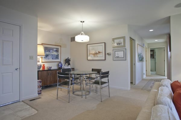 Bright and inviting common area with table and chairs