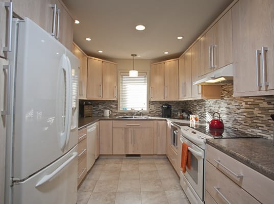 Modern kitchen interior with cabinets and appliances