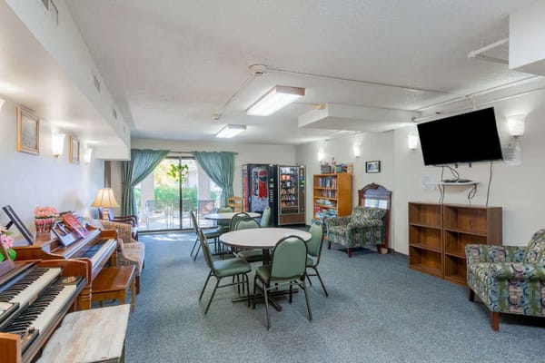 Bright and inviting community common area with seating