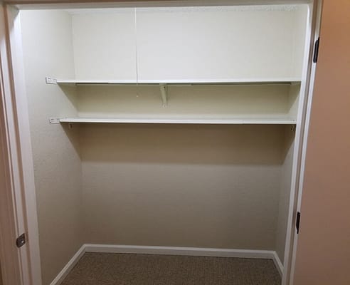 Empty closet with two shelves