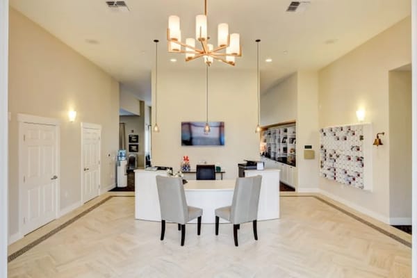 Modern reception area with seating and decorative lighting