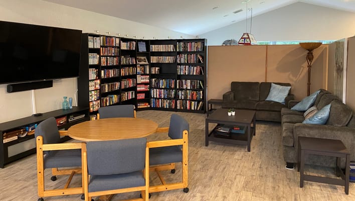 Common area with seating and bookshelves