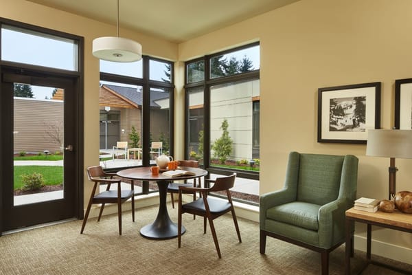 Bright interior space with a table and chairs