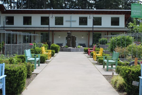 Front entrance of assisted living facility with colorful chairs
