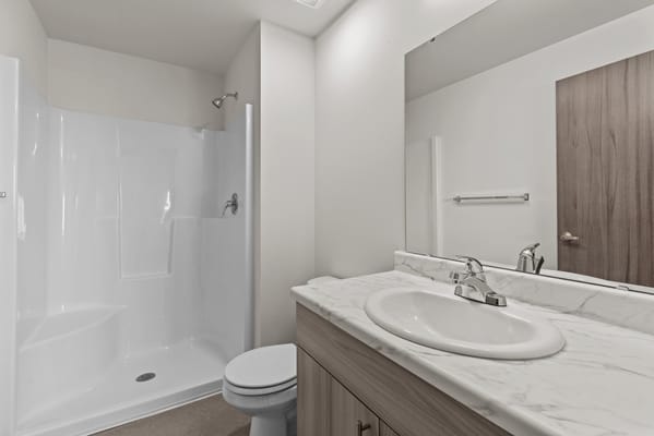 Modern bathroom with a shower and marble countertop