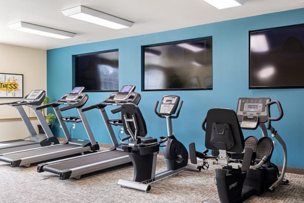Interior view of a fitness area with exercise equipment