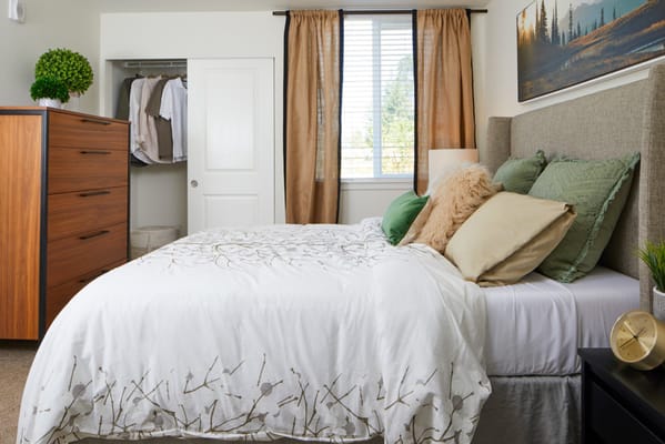 Cozy resident room with bed and wardrobe