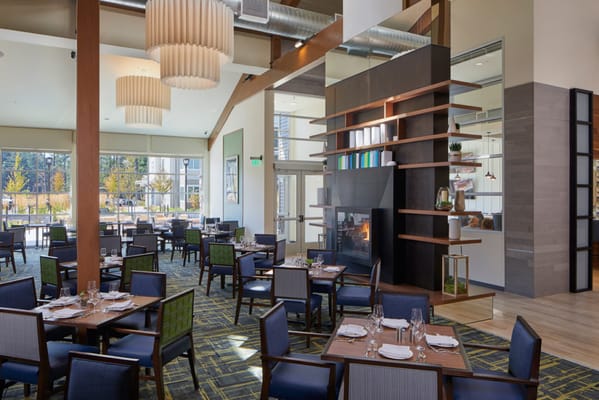 Modern dining room with tables and a fireplace