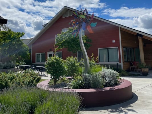 Exterior view of the facility with outdoor artwork