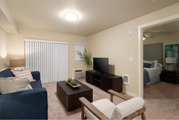 A cozy resident room with a living area and TV