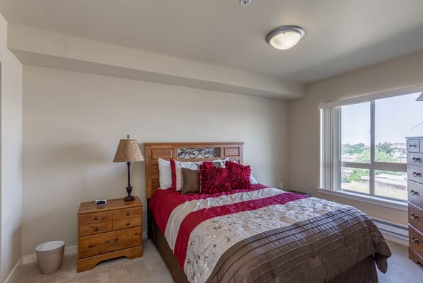 Cozy private resident room with a bed and nightstand