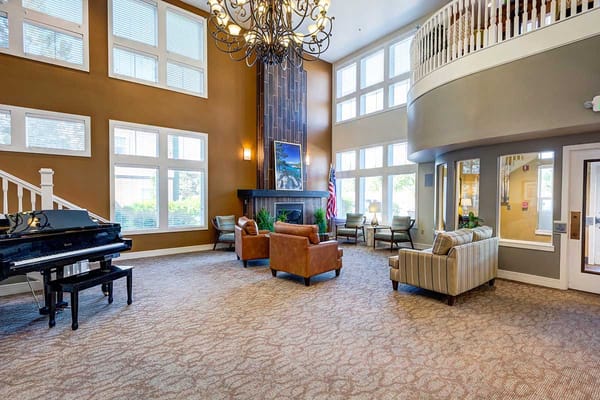 Spacious lobby with piano and seating area