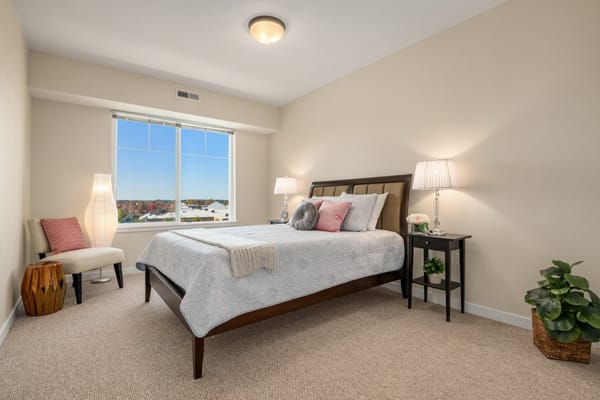 Bright, well-furnished resident room with large window