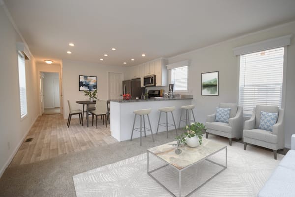 Stylish living room and kitchen area in a senior living facility