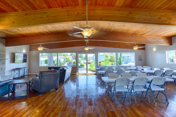 Spacious lounge with seating and large windows
