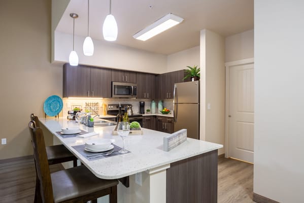 Modern kitchen interior with appliances and dining area