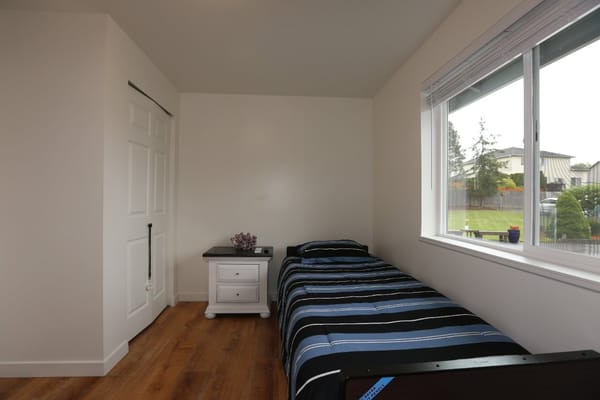 Private resident room with bed and window